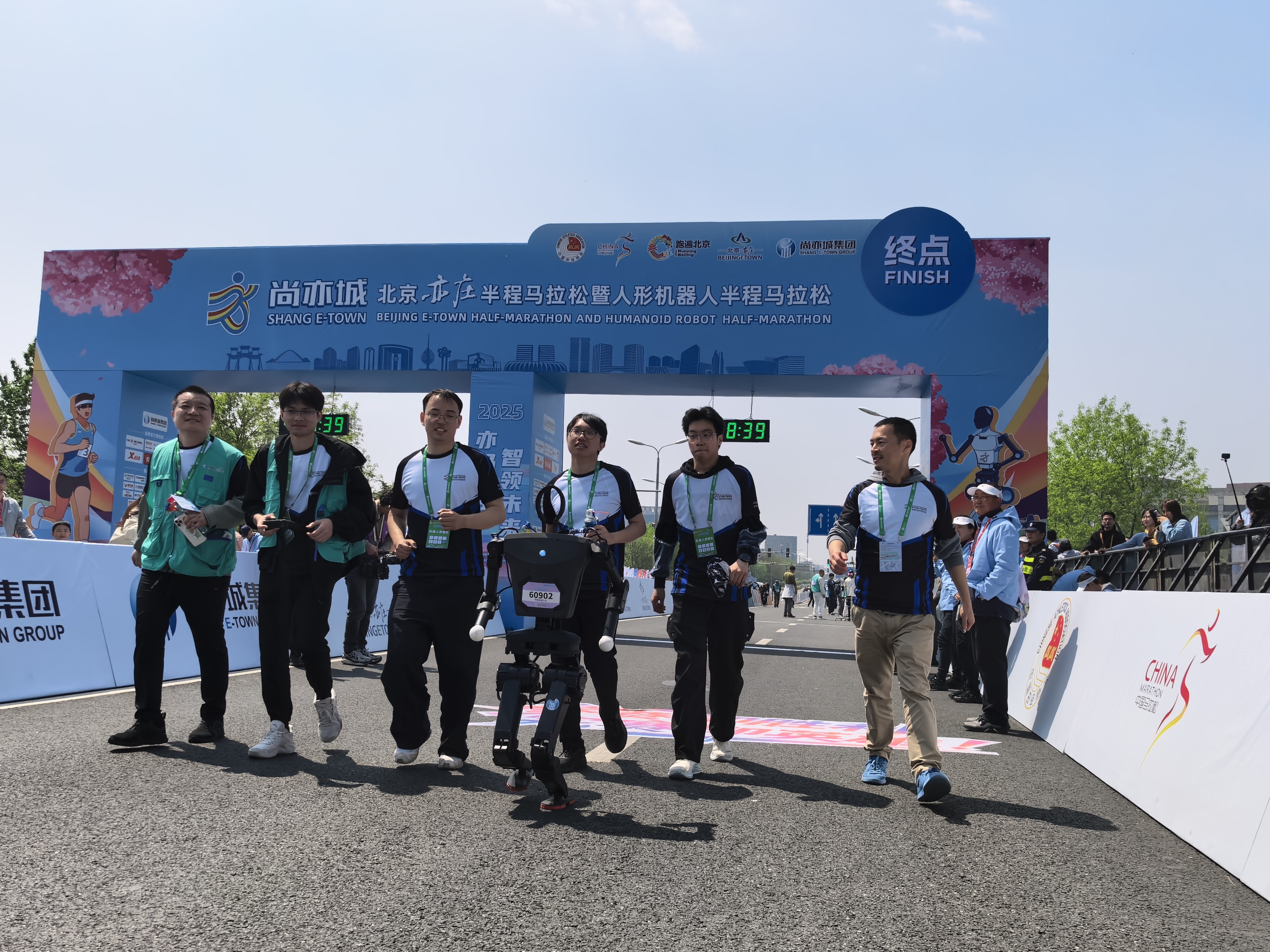 Humanoid robot crossing the finish line of the 2025 Beijing Half Marathon